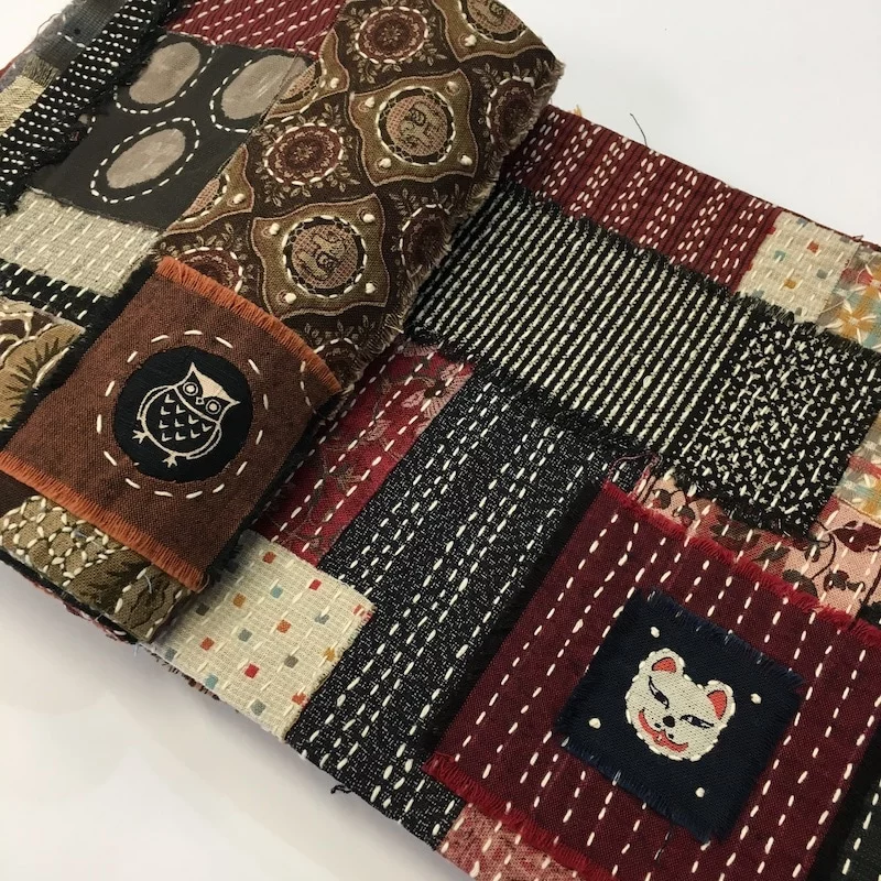 A stitch book by Many Lawler made with Jennifer featuring beautiful Japanese fabrics embellished with stitch