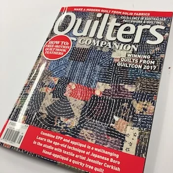 The cover of Quilters Companion where Jennifer's boro table runner was featured